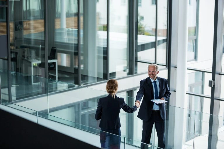 Businessman shaking hands with his colleague.