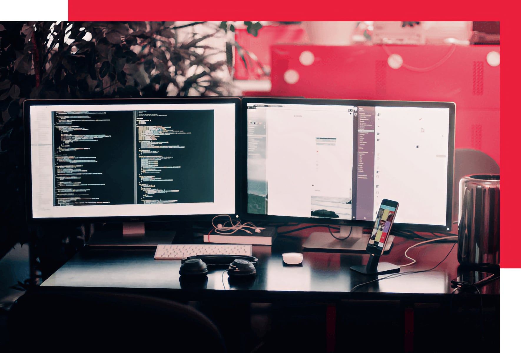 Desk with two monitors and phone.