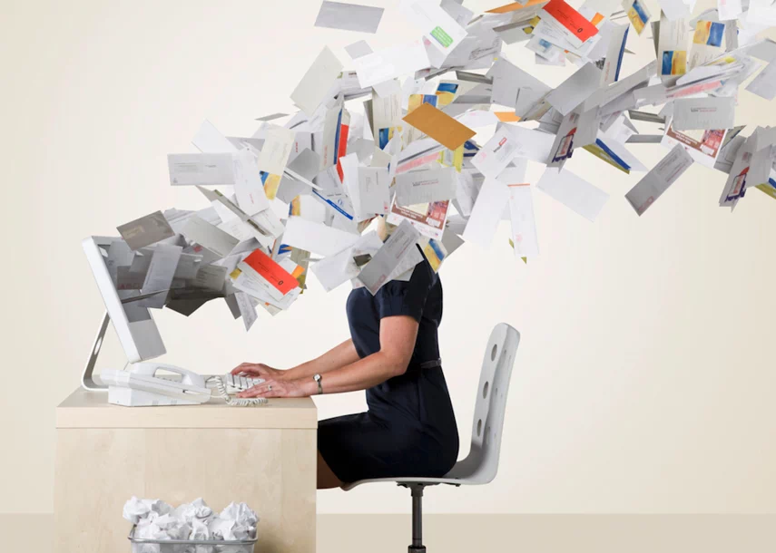 Thousands of letters come out of the screen and hit the employee in the face