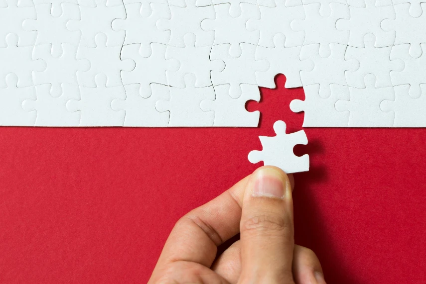 Red background made from jigsaw puzzle